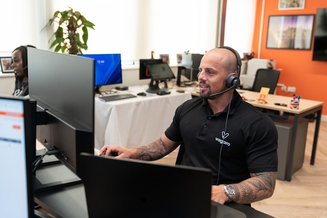 Call center agent listening carefully and taking notes during a sales discovery call