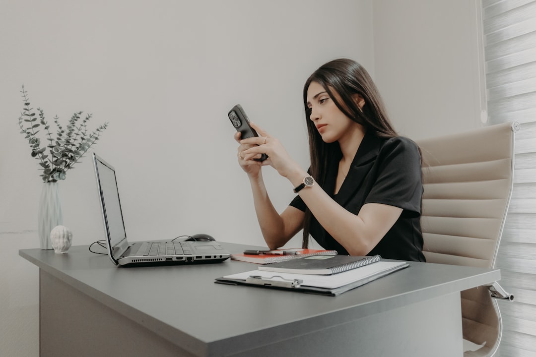 Sales representative making a follow-up call at a desk