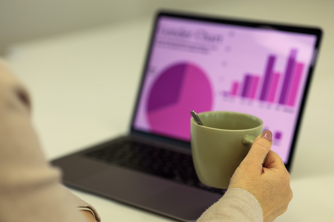Business owner reviewing website analytics on a laptop to diagnose lead generation