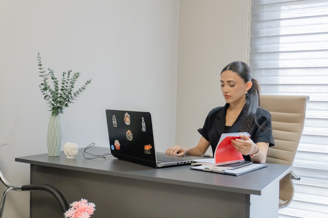 Attorney reviewing telemarketing compliance documentation at a desk
