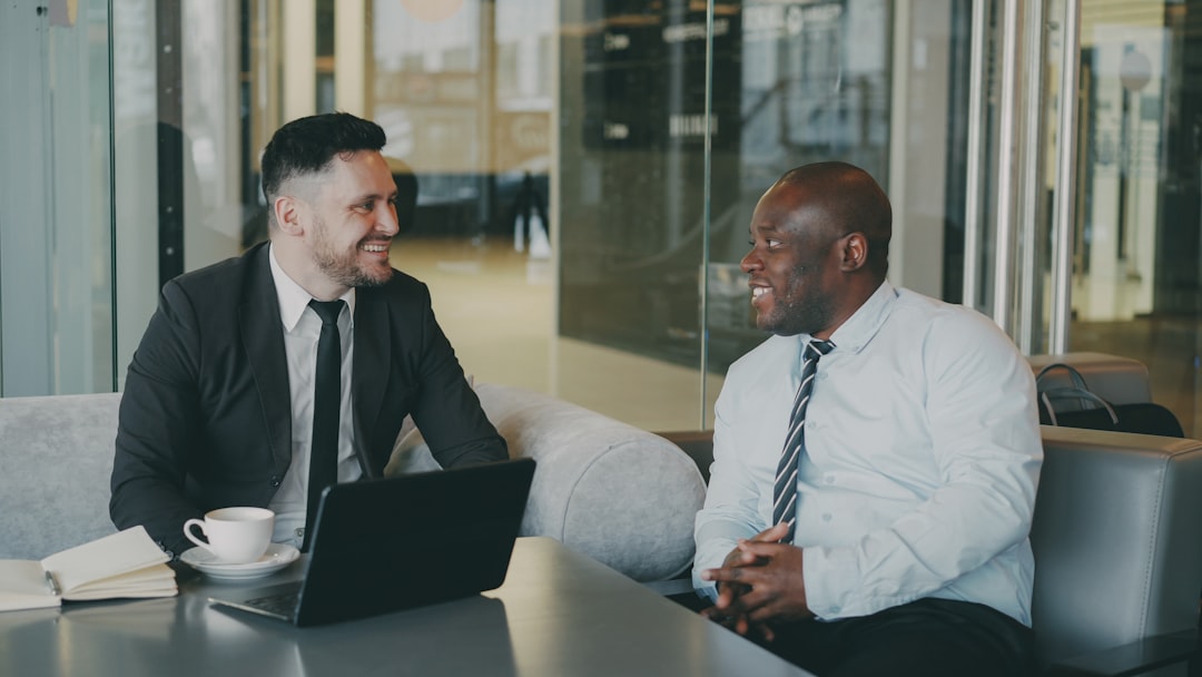 Two healthcare professionals building a referral relationship in an office meeting