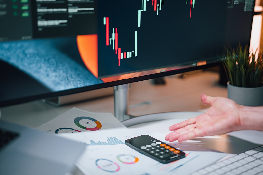 Business owner reviewing marketing analytics and cost metrics on a computer screen.