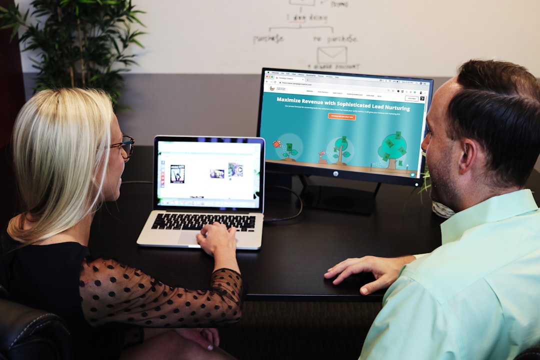 Healthcare marketing team reviewing digital advertising analytics on a laptop screen.